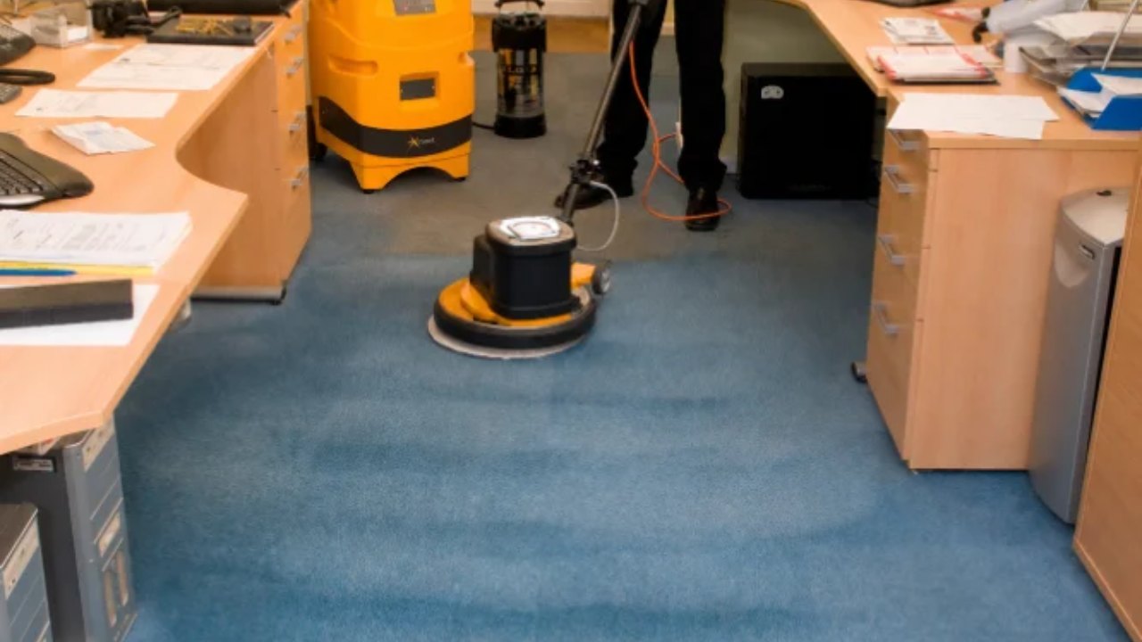 Supacleen operative using a floor cleaning machine on a commercial hard floor